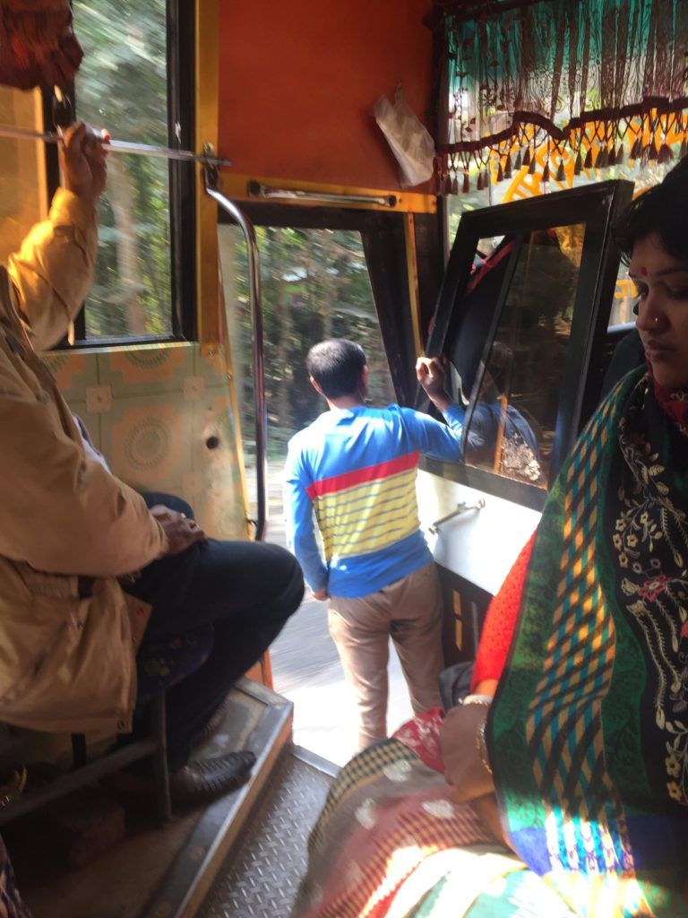 The bus to Khulna, conductor hanging out the doorway
