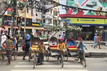 Cycle rickshaw drivers, Dhaka, Bangladesh. You haven't lived til you've zipped around Dhaka in one. There is a veritable fleet of them on corner.