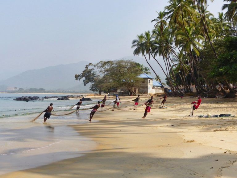 Fishermen on the beach. Bureh Beach, the Freetown Penninsula, Sierra Leone