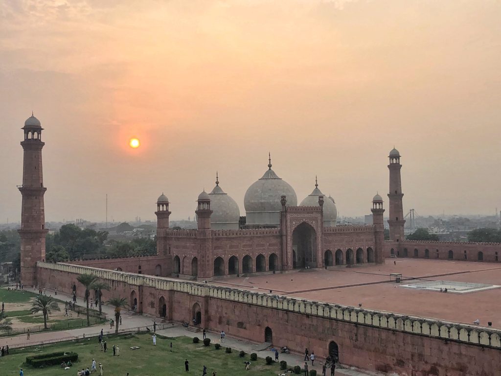 Badshahi Mosque, with evening cricket going on outside