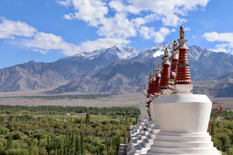 A row of stupas overlooking the Indus Valley, at Shey Palace. Near Leh, Ladakh, India