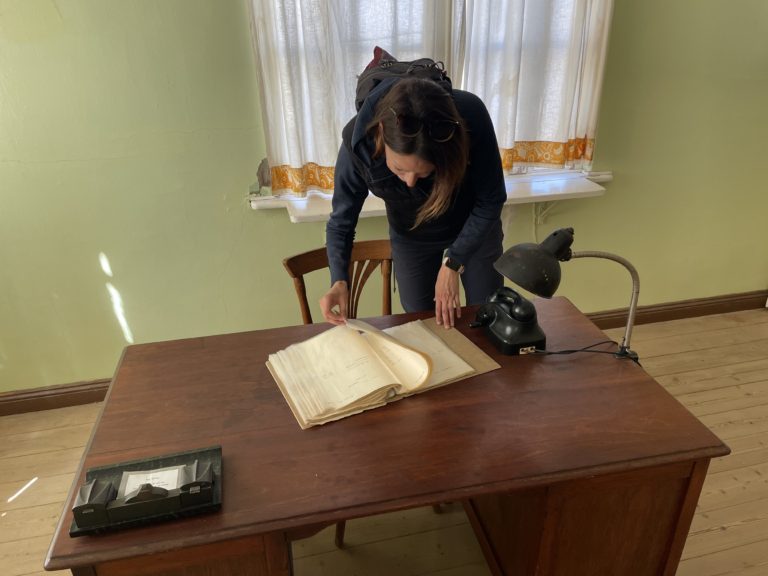 Perusing the purchaser's order book straight out of the 1920s, in Kolmanskop
