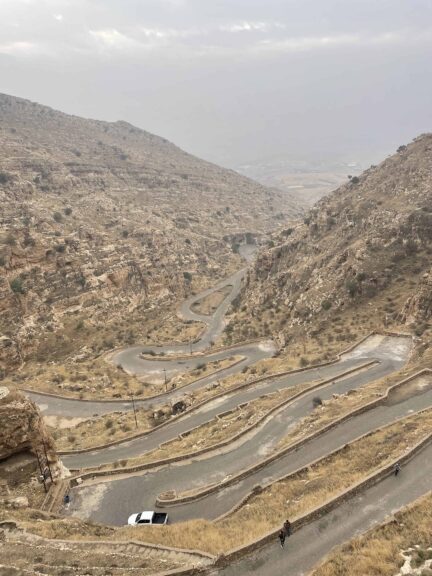 Steep winding road leading up to a monastery. Iraqi Kurdistan in winter.