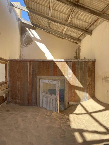 Abandoned buildings in Kolmanskop, a Namibian mining ghost town