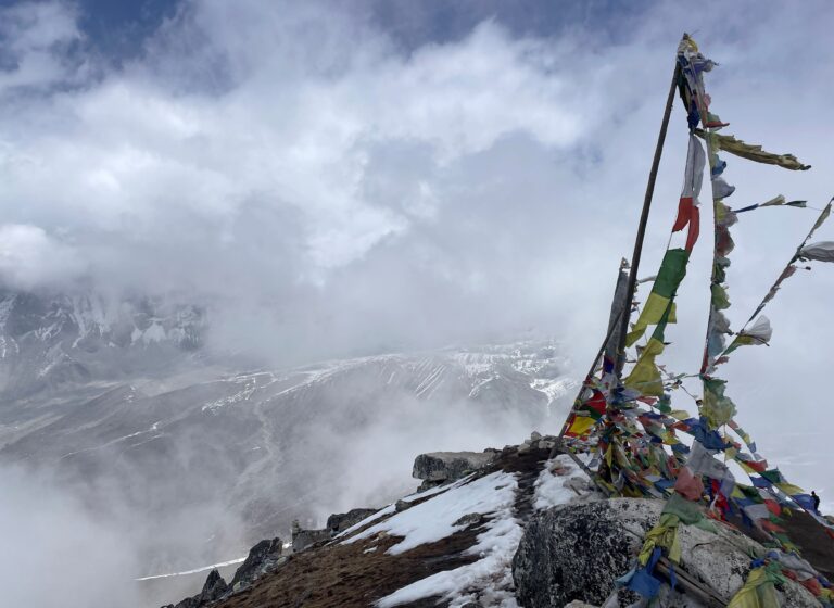 Prayer flags at a peak