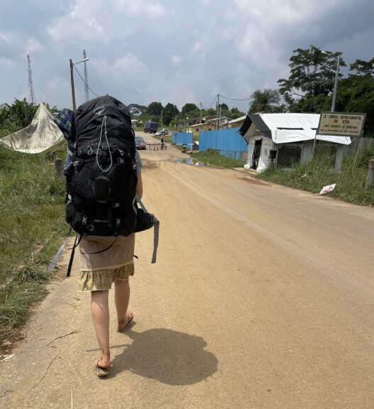 Reaching Gabon's side, with the vax building ahead on the right and immigration on the left (obscured by my enormous backpack)