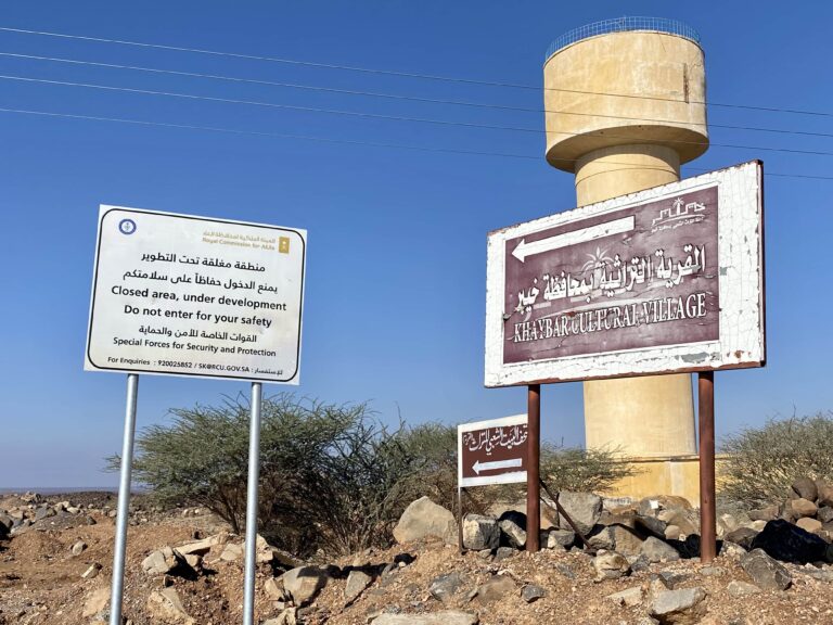Pointing the way to a tourist attraction and warning us off at the same time