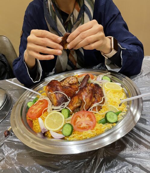 Digging into a platter of khabsa. When we didn't know what to order staff would give us suggestions and extra bites of this and that. You won't go hungry – except possibly at prayer time